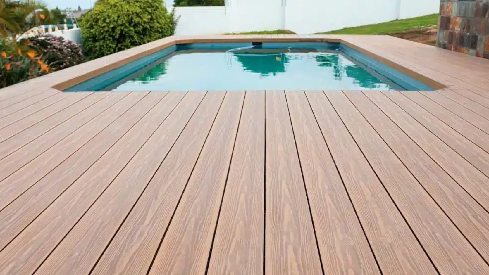 Failing timber decking on a coastal hotel property before replacement